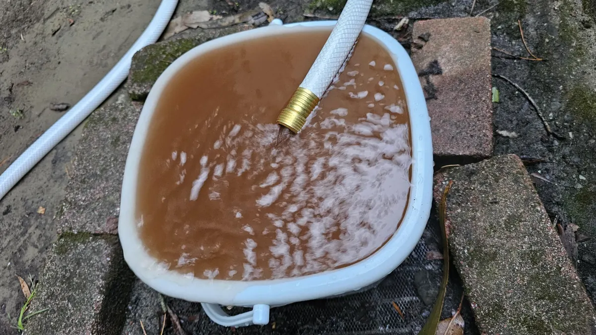 Rumbling water heater with sediment
